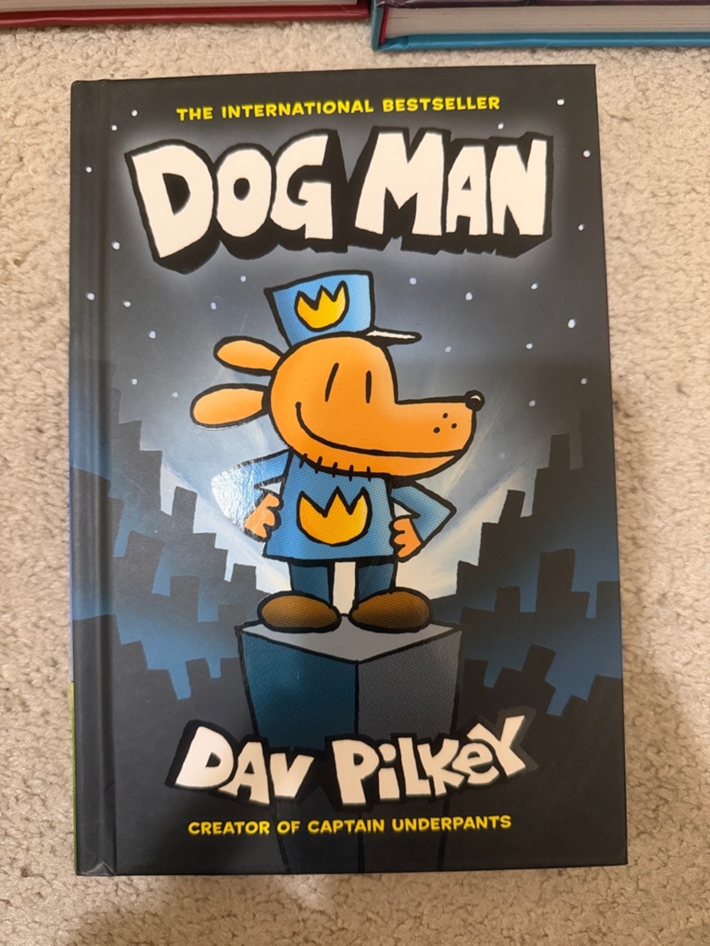 Scholastic Dog Man Hardcover — Blue, Black & Orange Cover